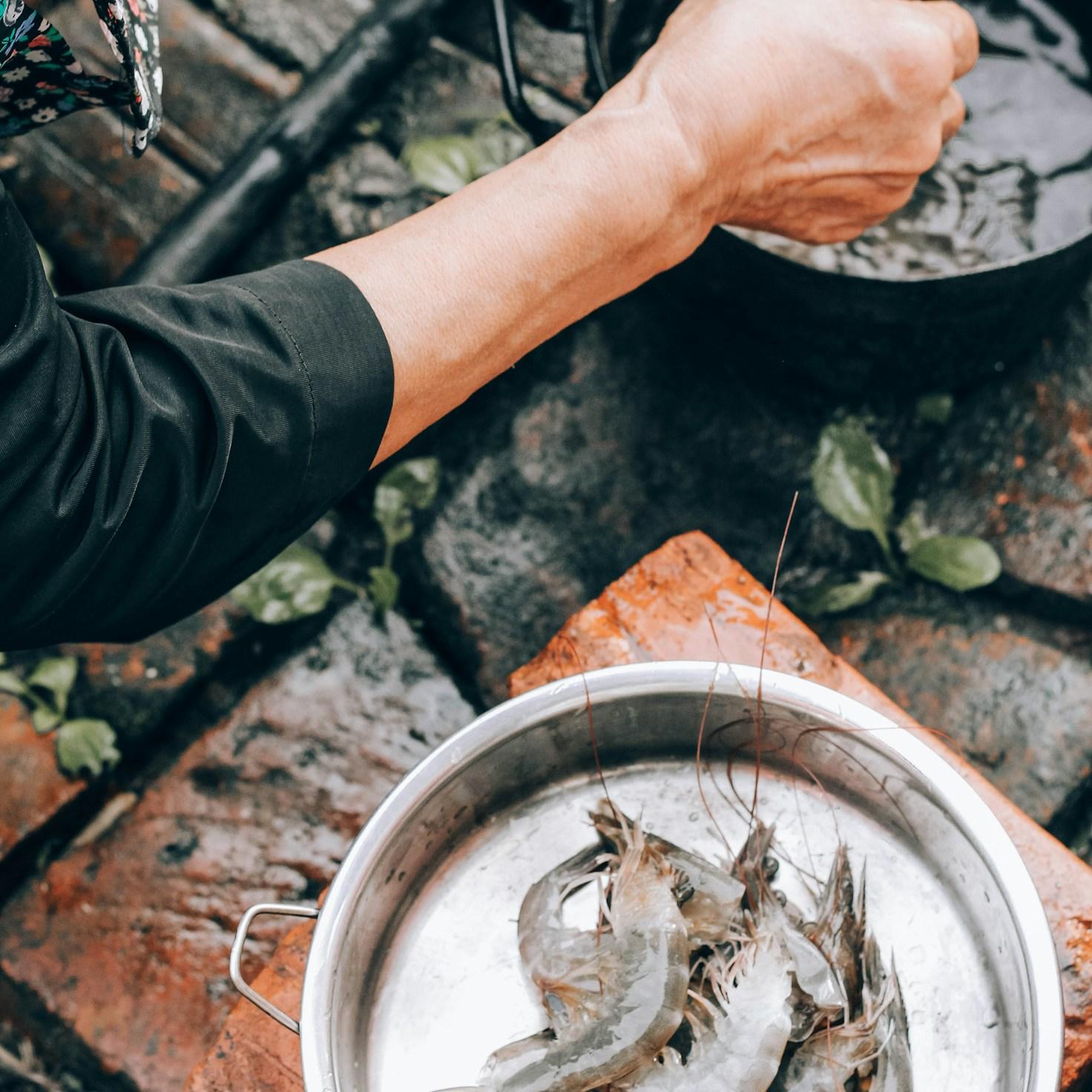 Community members collaborating in a contemporary kitchen, exchanging recipes and techniques